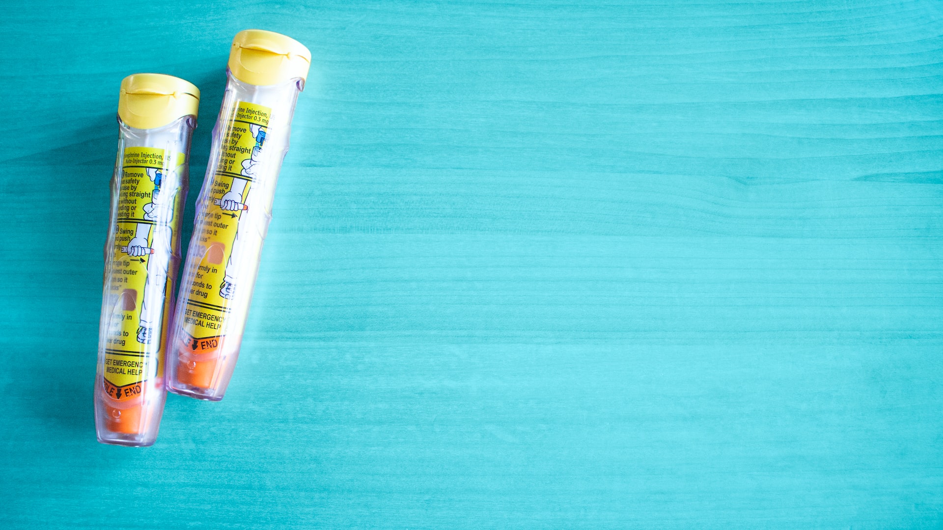 Two epipens infront of a blue background