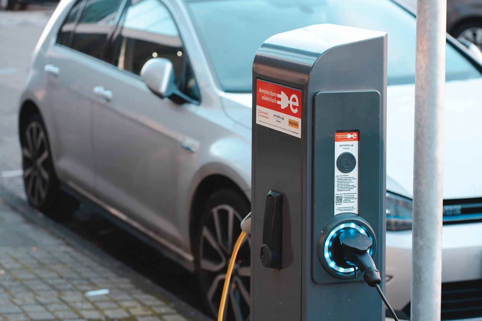 an electric car charging on the street