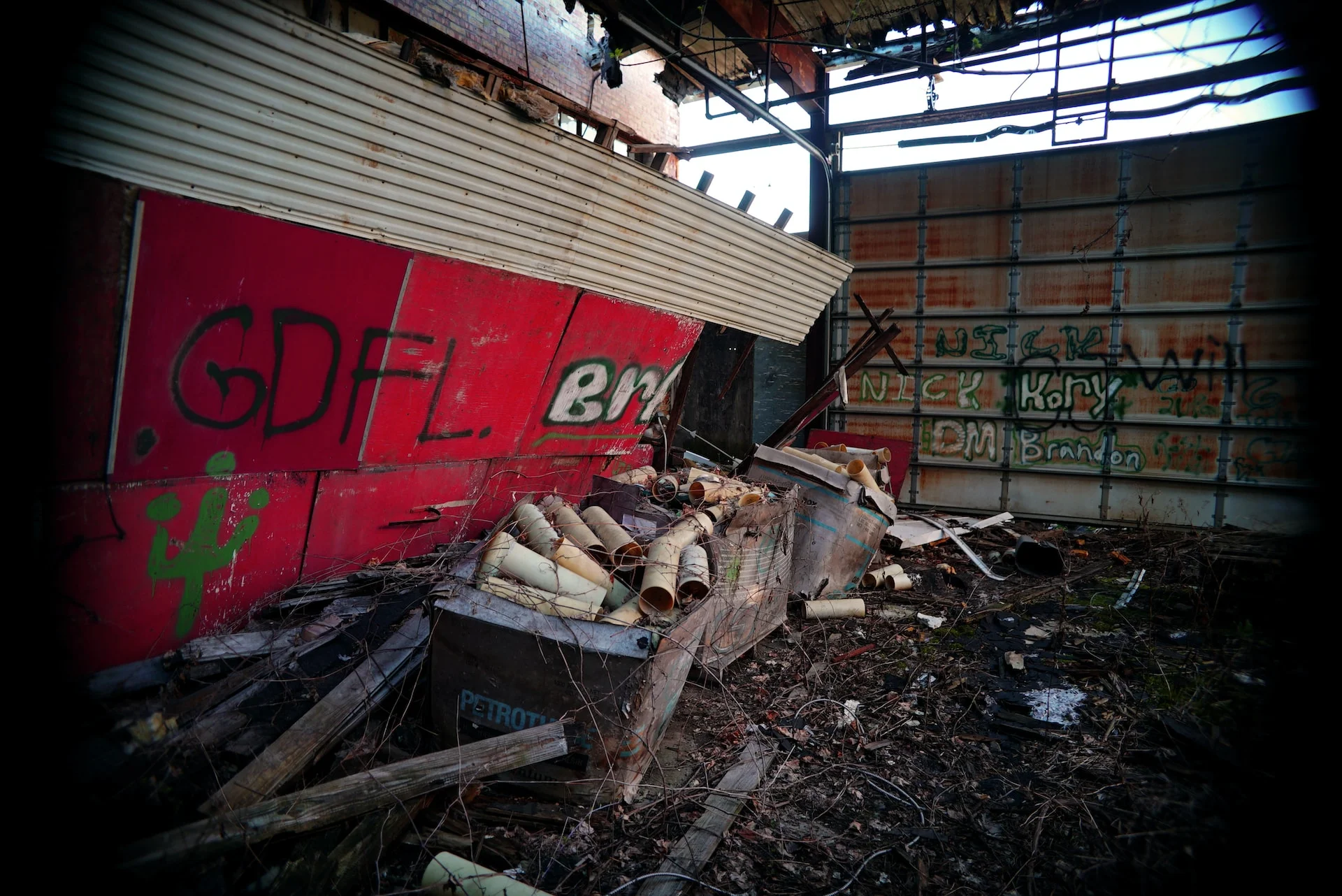 A building struck hard by a disaster, with debris piled up outside