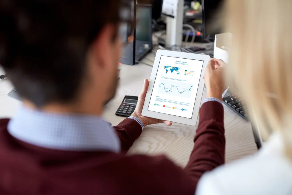 Man looking at an analysis graph on a tablet